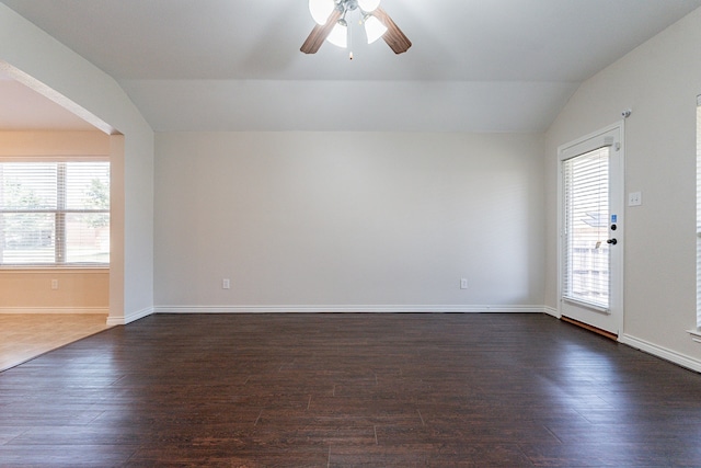 spare room with ceiling fan, lofted ceiling, and wood-type flooring