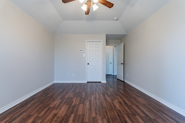 spare room featuring ceiling fan, vaulted ceiling, and dark hardwood / wood-style floors