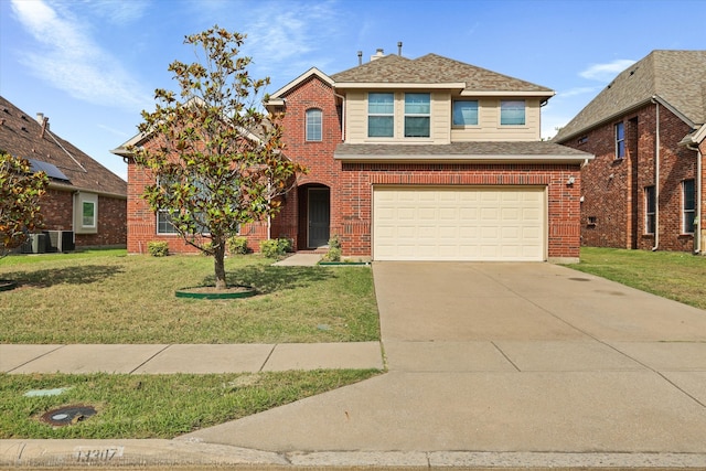 view of front property with a garage and a front yard