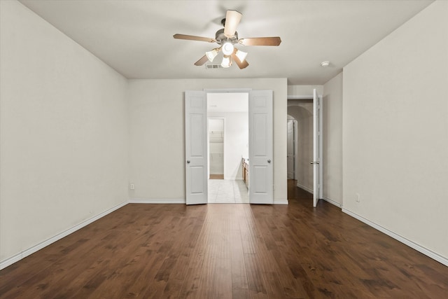 unfurnished bedroom featuring ceiling fan and wood-type flooring