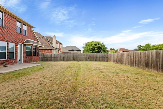 view of yard featuring a fenced backyard and a patio