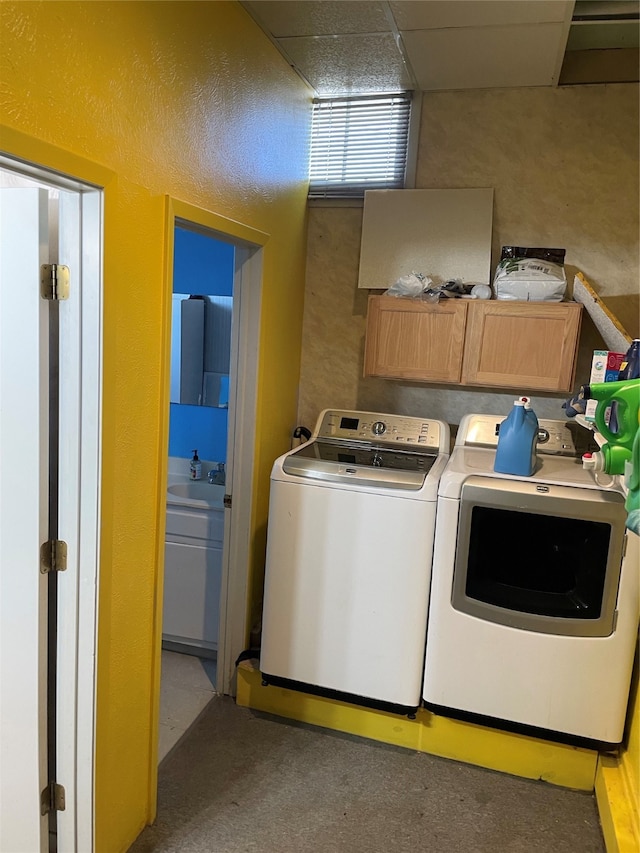 laundry area with cabinets and independent washer and dryer