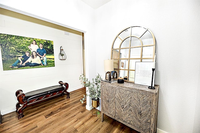 interior space featuring wood finished floors and baseboards