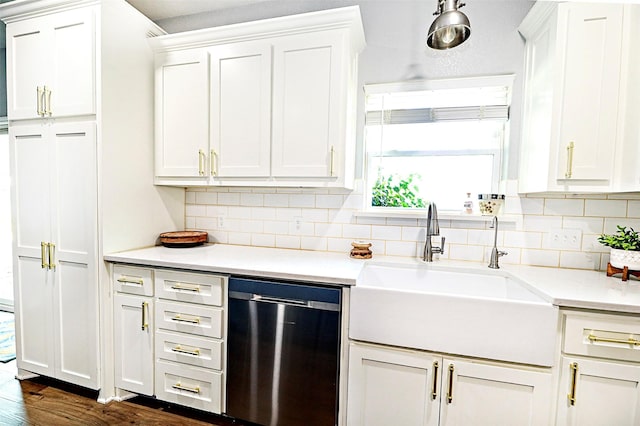 kitchen with a sink, decorative backsplash, white cabinets, and dishwasher