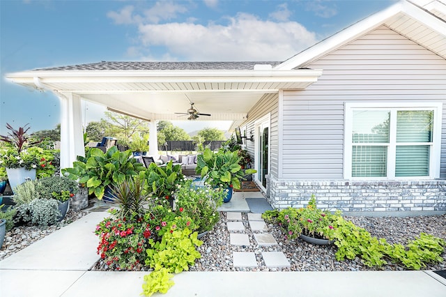 exterior space featuring ceiling fan