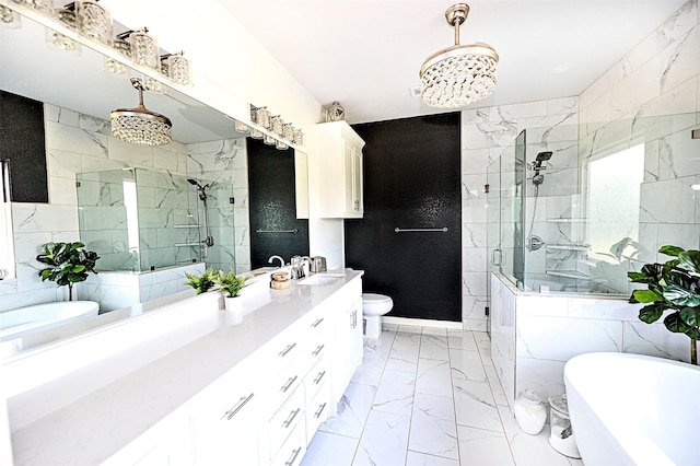 full bath featuring marble finish floor, tile walls, double vanity, a freestanding bath, and a shower stall