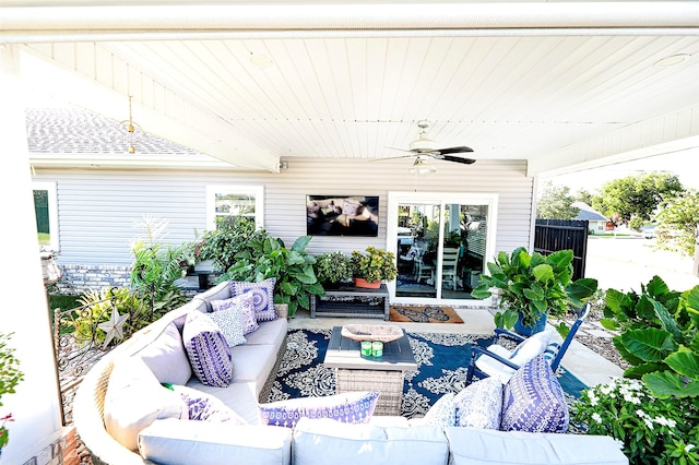 view of patio with outdoor lounge area and ceiling fan