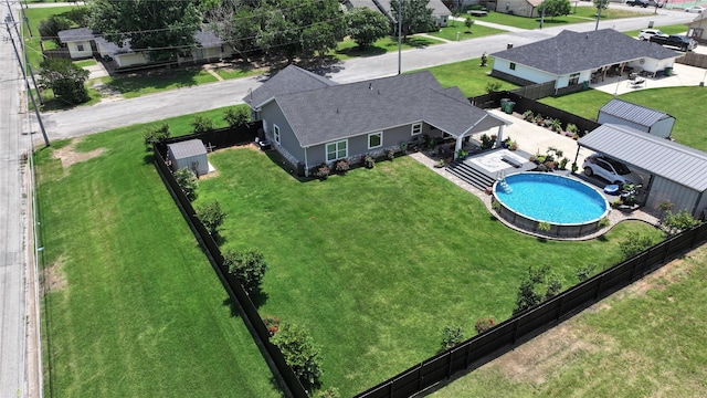 birds eye view of property with a residential view