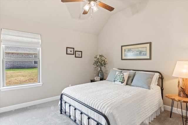 carpeted bedroom featuring ceiling fan, baseboards, and vaulted ceiling