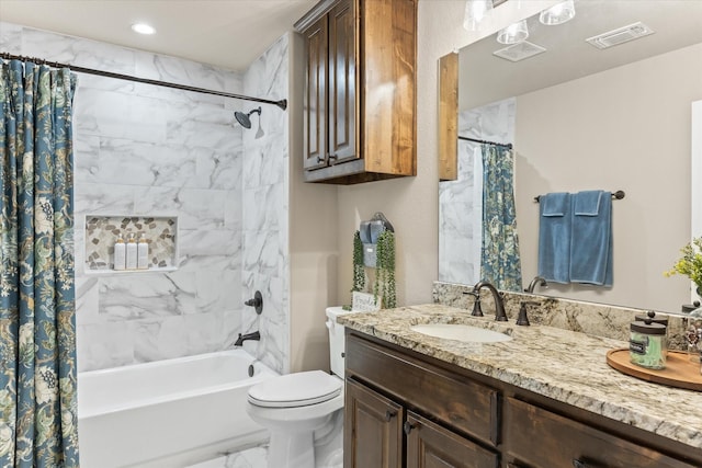 bathroom featuring vanity, visible vents, shower / bath combo, toilet, and marble finish floor