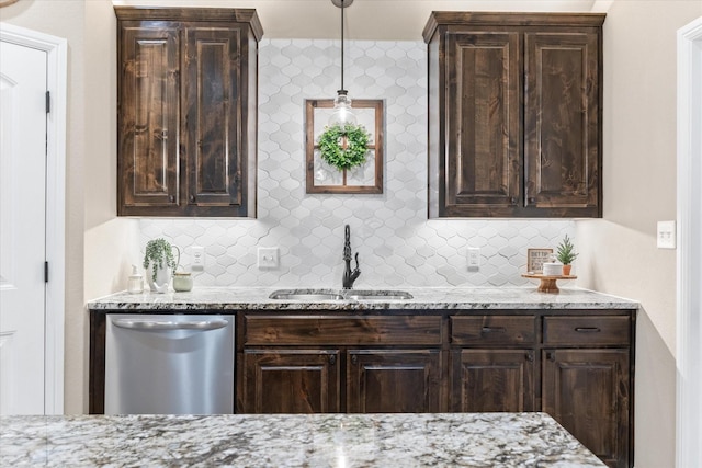 kitchen with light stone counters, a sink, dark brown cabinets, stainless steel dishwasher, and tasteful backsplash