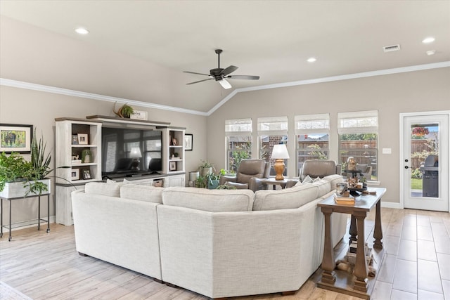 living area with a wealth of natural light, ornamental molding, and vaulted ceiling