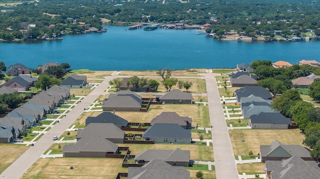 bird's eye view featuring a residential view and a water view