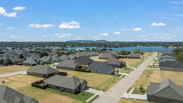 aerial view with a residential view and a water view