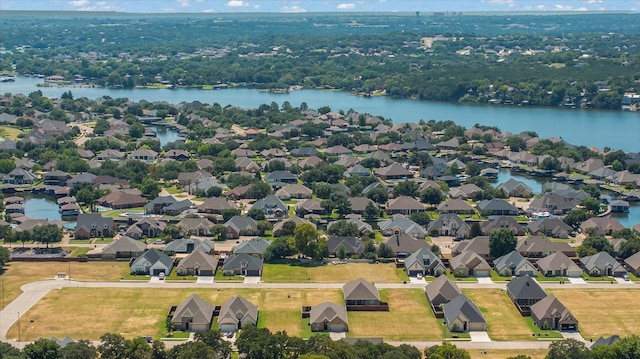 birds eye view of property featuring a residential view and a water view