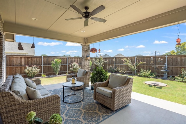 view of patio with outdoor lounge area, a fenced backyard, and a ceiling fan