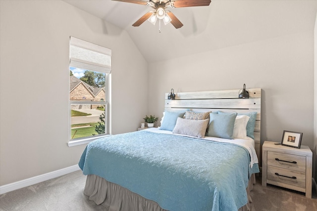 carpeted bedroom with lofted ceiling, multiple windows, baseboards, and ceiling fan