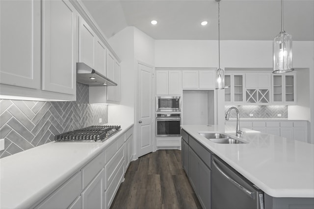 kitchen with white cabinetry, an island with sink, stainless steel appliances, and sink