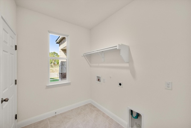 laundry room with electric dryer hookup, hookup for a gas dryer, hookup for a washing machine, and light tile patterned floors