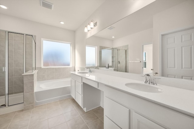 bathroom with tile patterned flooring, vanity, and independent shower and bath