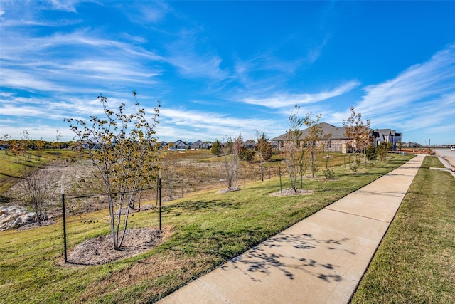 view of property's community with a lawn