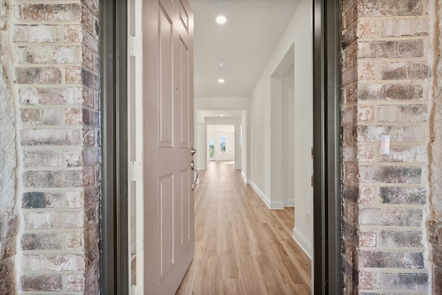 corridor featuring light hardwood / wood-style floors