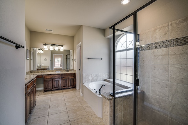 bathroom featuring plus walk in shower, tile patterned floors, and vanity