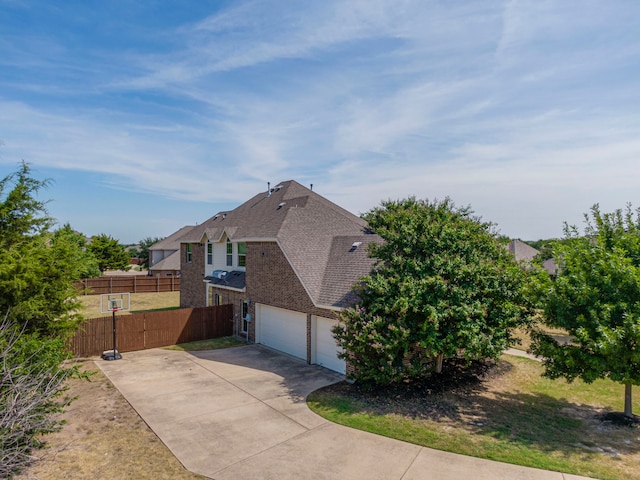 view of side of home featuring a garage