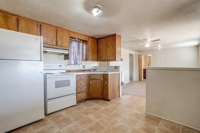 kitchen with a textured ceiling, ceiling fan, and white appliances