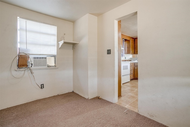 empty room with cooling unit and light carpet