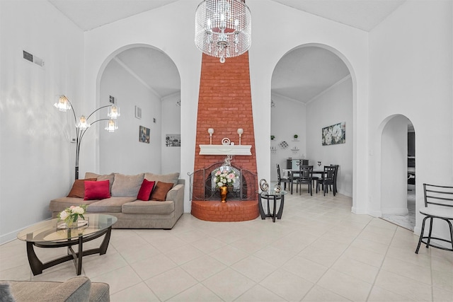 living room featuring light tile patterned flooring, brick wall, and a chandelier