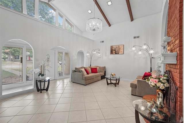 living room featuring visible vents, an inviting chandelier, beam ceiling, light tile patterned flooring, and arched walkways