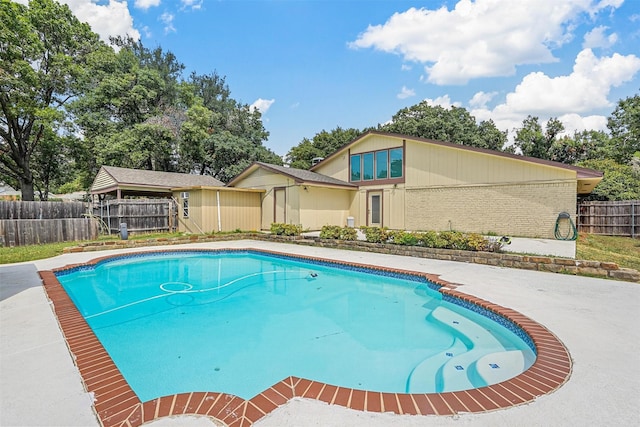 view of pool with fence and a fenced in pool