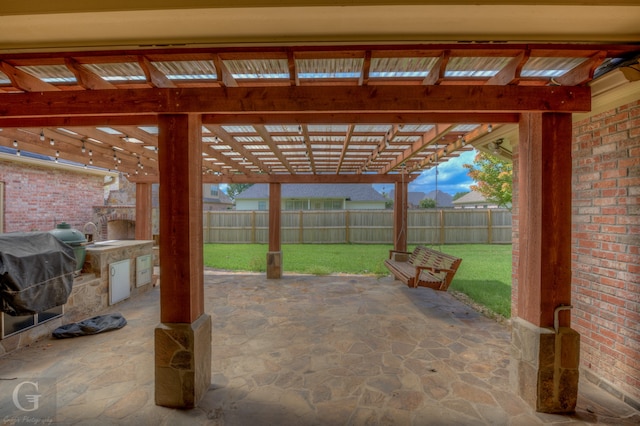 view of patio with a pergola and exterior kitchen