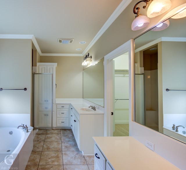 bathroom featuring crown molding, tile patterned flooring, tiled bath, and vanity