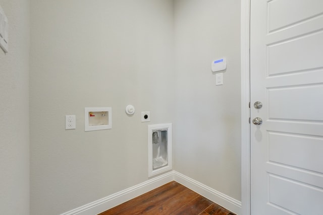 clothes washing area with dark wood-type flooring, gas dryer hookup, hookup for a washing machine, and electric dryer hookup