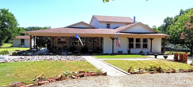 view of front facade featuring a front lawn and a porch