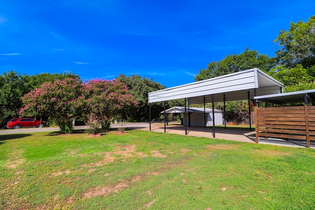 view of yard with a carport