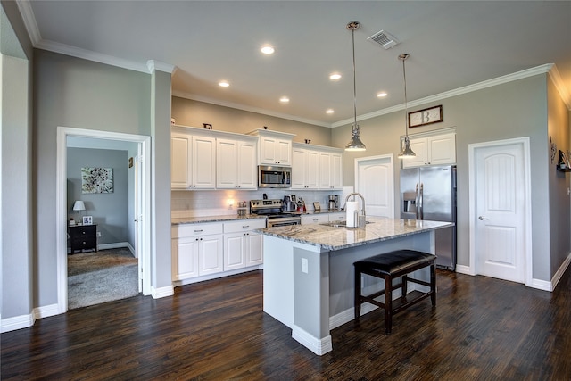 kitchen with appliances with stainless steel finishes, decorative backsplash, dark hardwood / wood-style floors, and white cabinetry