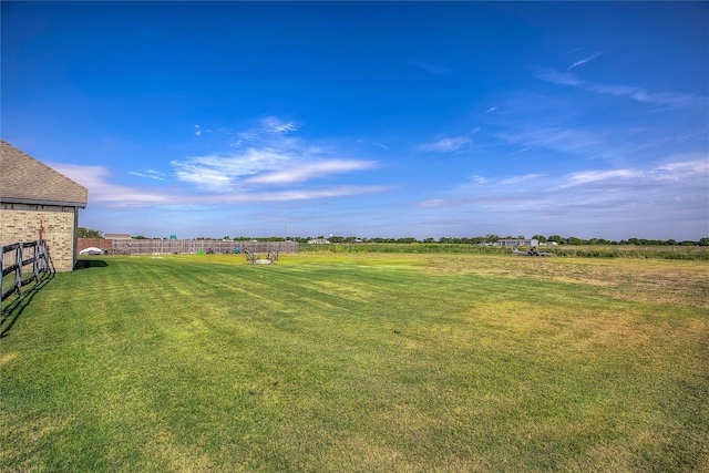 view of yard with a rural view