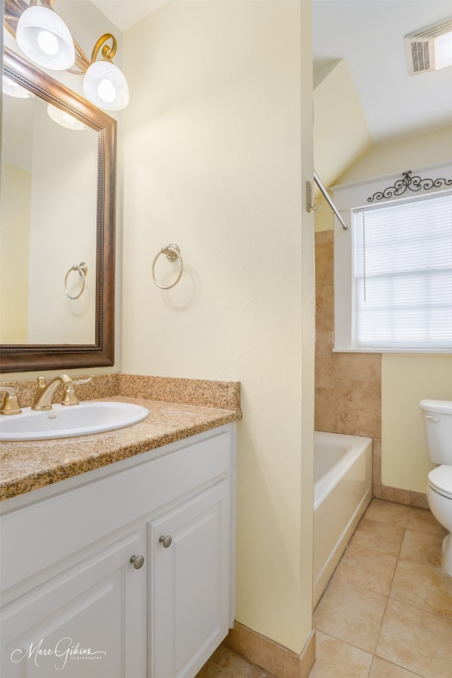 bathroom featuring toilet, vanity, and tile patterned floors