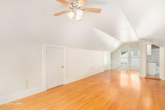 bonus room with ceiling fan, vaulted ceiling, and light hardwood / wood-style flooring