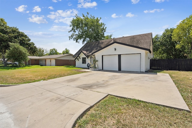 ranch-style home featuring a garage and a front lawn