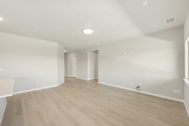 unfurnished room with light hardwood / wood-style floors