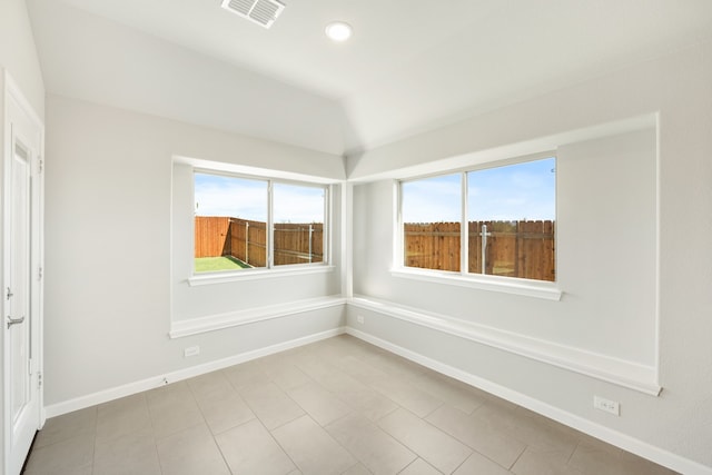 spare room with light tile patterned floors