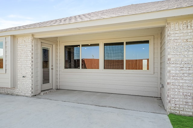 property entrance featuring a patio