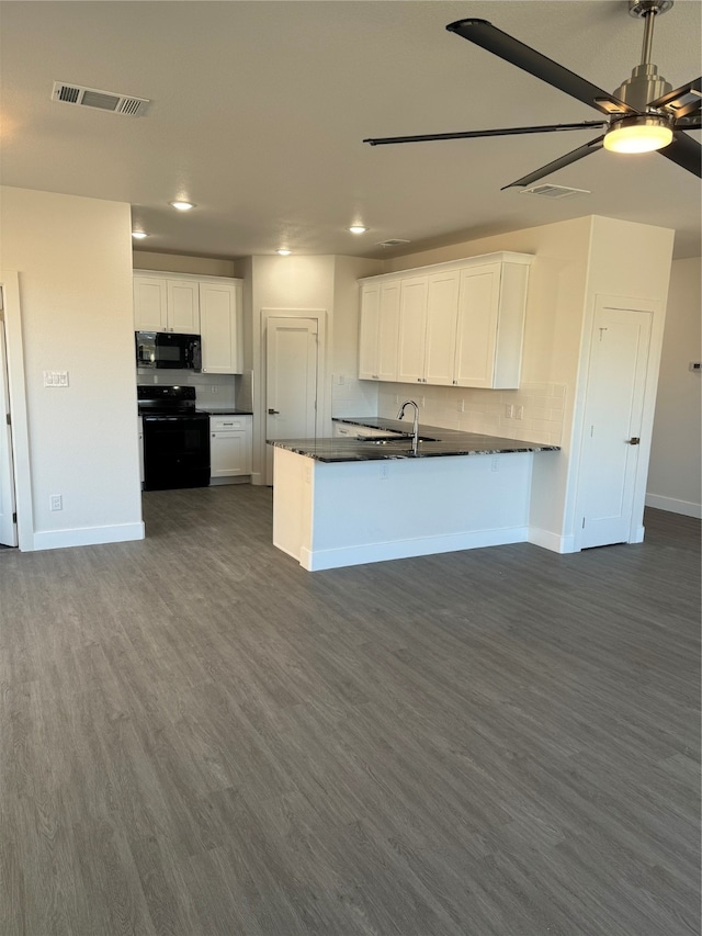 kitchen with white cabinetry, dark hardwood / wood-style flooring, and black appliances