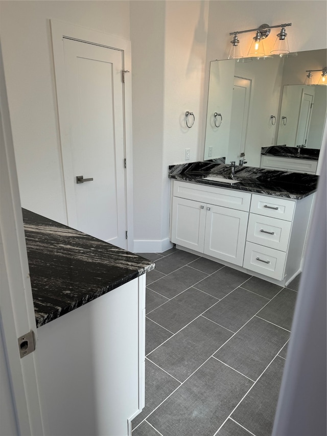 bathroom featuring tile patterned flooring and vanity