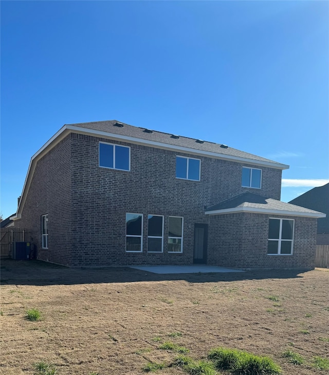 back of house featuring central AC unit and a patio area