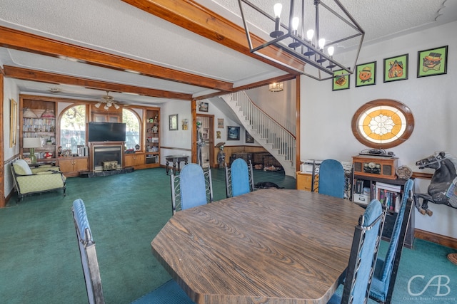 dining room featuring ceiling fan with notable chandelier, dark carpet, a textured ceiling, and beamed ceiling